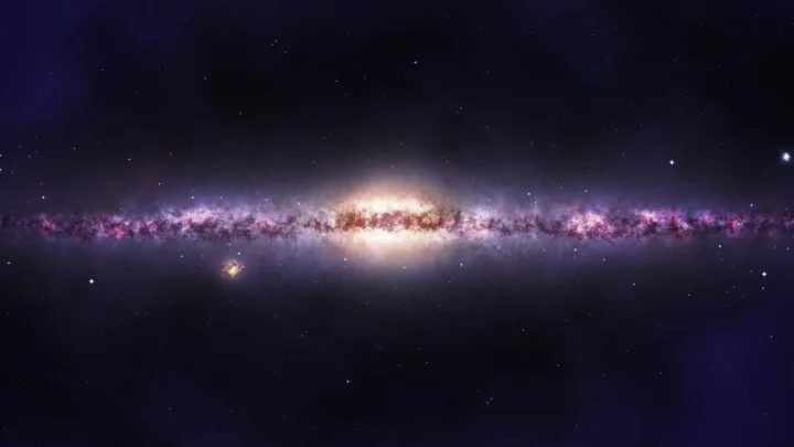 一条明亮的星系横贯深色星空，中心呈现耀眼的金白色光芒。