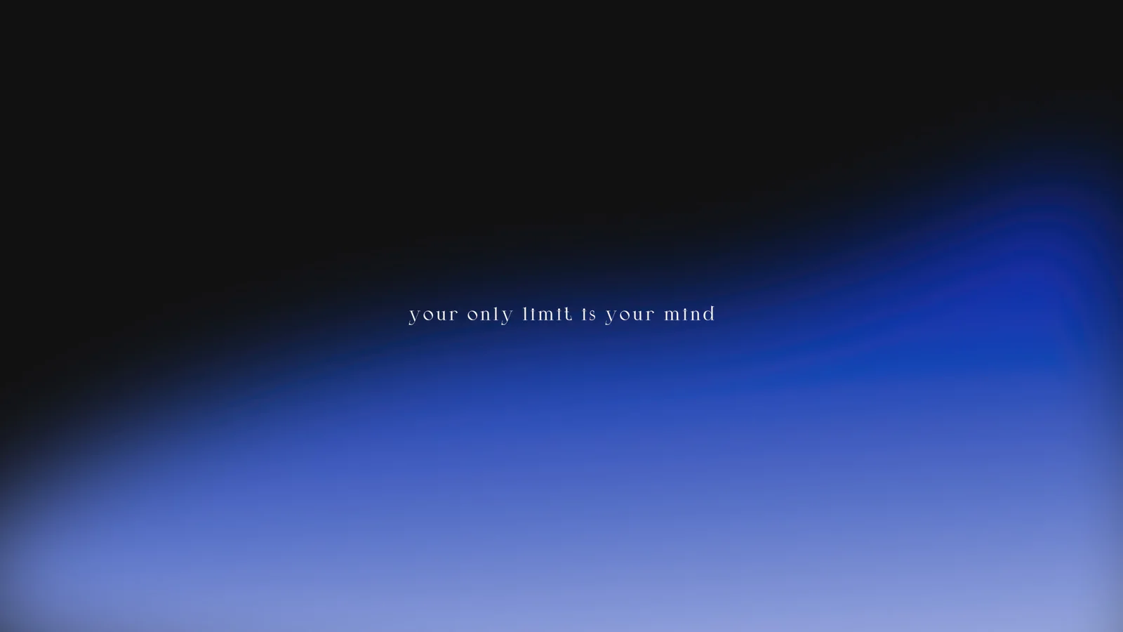 深蓝与浅蓝渐变光影背景上居中显示着“your only limit is your mind”文字。