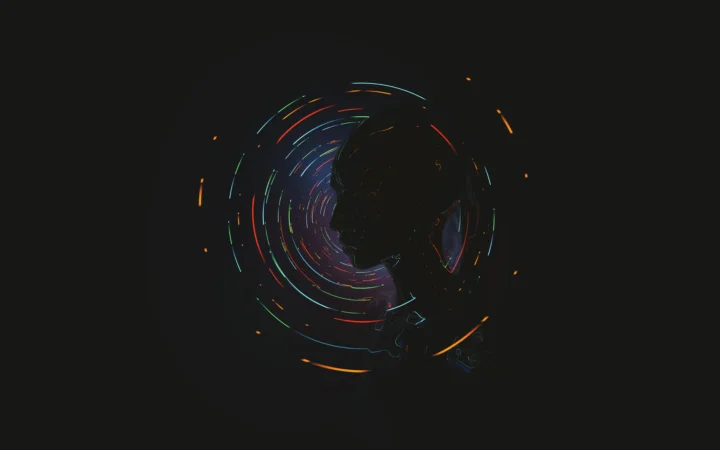A dark profile silhouette surrounded by glowing neon rings on a black background.